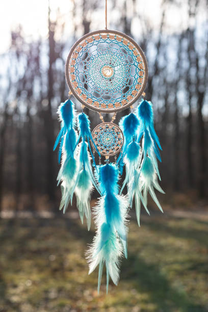 istock Handmade dream catcher with feathers threads and beads rope hanging 1390938452
