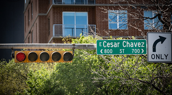 A sign for Cesar Chaves St, in downtown Austin, Texas, USA.