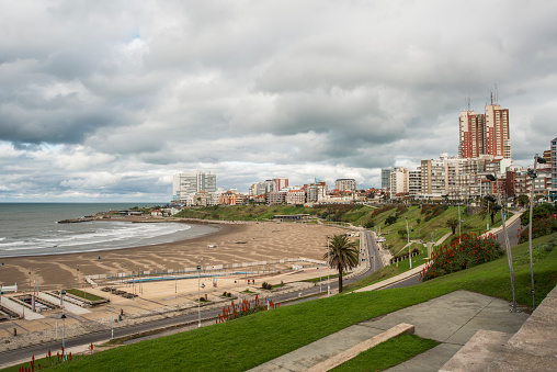 city of Mar del Plata. some buildings are seen, the grass, the flowers, the beach and the sea