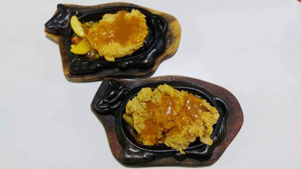 istock Double Crispy Chicken Steak served on a hot plate 1390944613