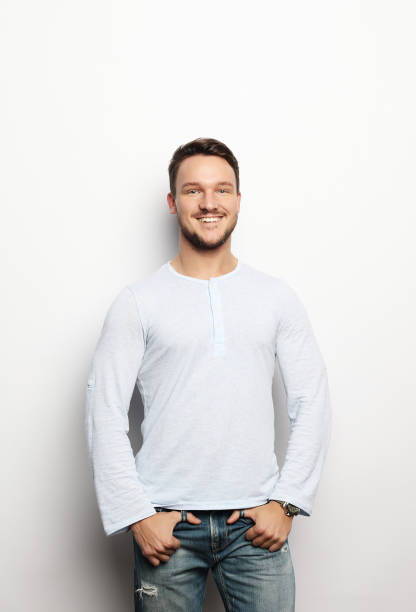 istock Handsome young man in smart casual wear looking at camera 1390946249