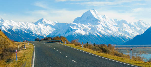 The road to Mount Cook New Zealands highest peak runs along side the Tasman River The road to Mount Cook New Zealands highest peak runs along side the Tasman River rood stock pictures, royalty-free photos & images
