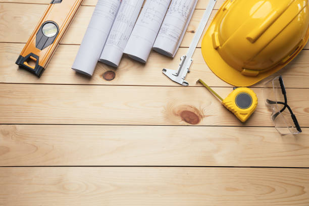 istock Work safety. Standard Construction site protective equipment on  top view wooden background, flat lay, copy space,safety first concepts. 1390949528