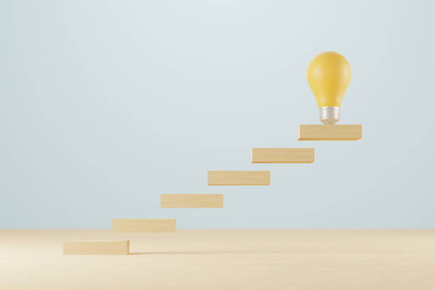 istock Idea mindset concept. Light bulb and wooden block growing growth step on wood table. 3d illustration 1390952105