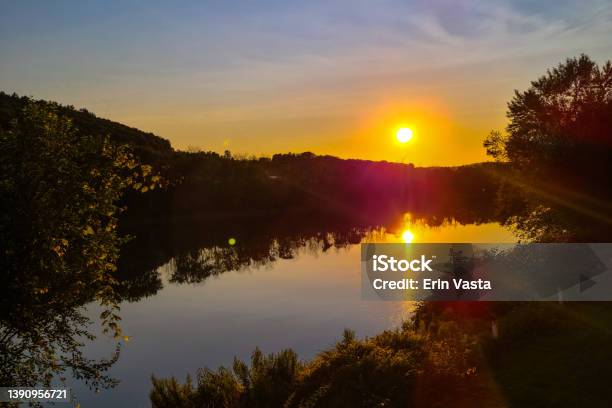 Sunset Over River Stock Photo - Download Image Now - Ithaca, New York State, Scenics - Nature