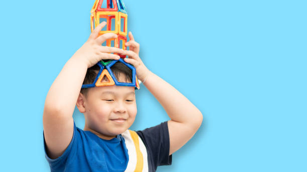 istock kid play toy with smile 1390957840