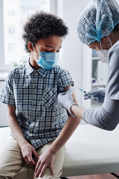 istock Child getting vaccine at hospital 1390959922