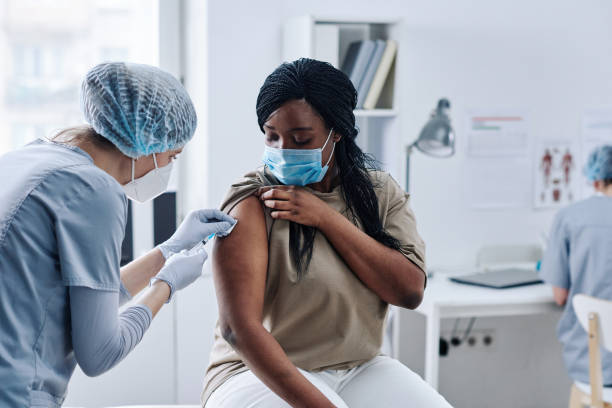 istock Woman getting vaccination from covid 1390959933