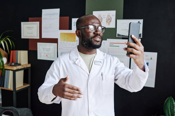 istock Doctor having online talk on mobile phone 1390960769