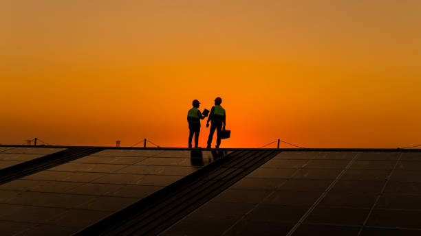 istock Engineers walking on roof inspect and check solar cell panel by hold equipment box and radio communication ,solar cell is smart grid ecology energy sunlight alternative power factory concept. 1390963005
