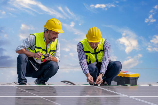 istock Engineers walking on roof inspect and check solar cell panel by hold equipment box and radio communication ,solar cell is smart grid ecology energy sunlight alternative power factory concept. 1390963213
