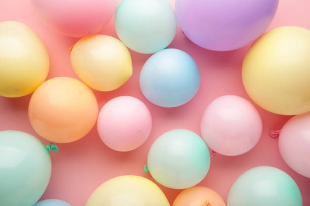 istock Birthday background with colorful balloons, top view 1390965201