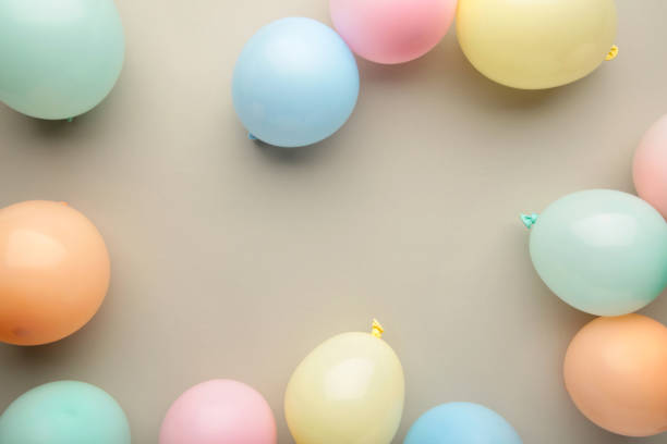 istock Birthday background with colorful balloons, top view 1390965946