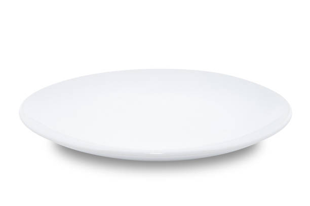 istock White circle ceramics plate isolated on white background. 1390967280