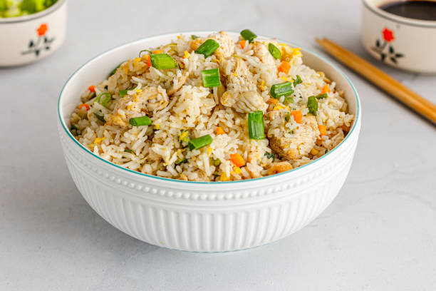 Close-Up Asian Chicken Fried Rice, Popular Take Out Food Fried Rice in a Bowl Low Angle Photo fried rice stock pictures, royalty-free photos & images