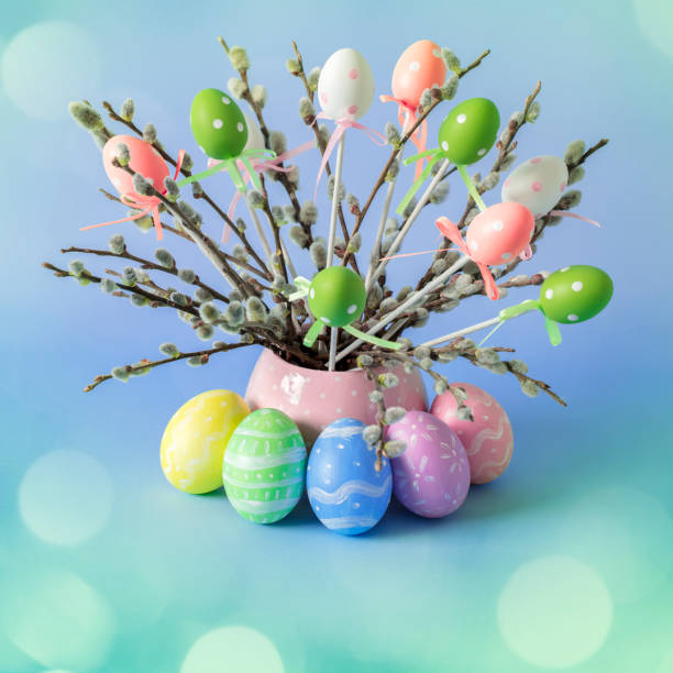 istock Easter eggs and pussy willow twigs with catkins in a vase 1390970512