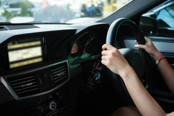 istock Woman driving a car. 1390970633