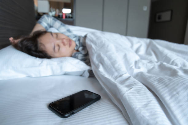 istock Woman snooze the alarm clock 1390971718