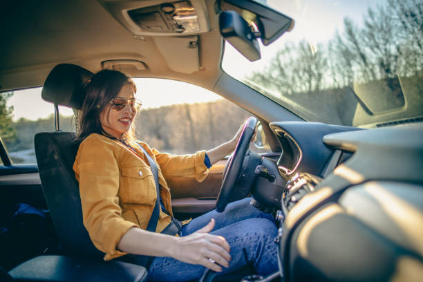 istock Young woman driving a car 1390974789