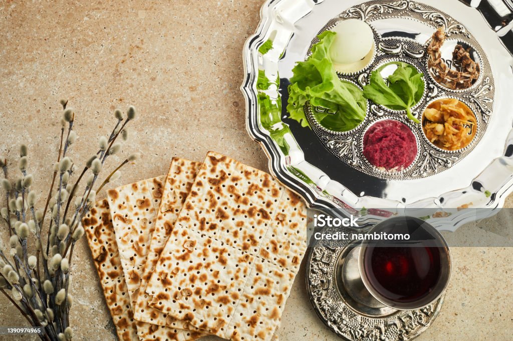 Passover Seder plate with traditional food ontravertine stone background Passover Seder plate with traditional food ontravertine stone background. Passover Stock Photo