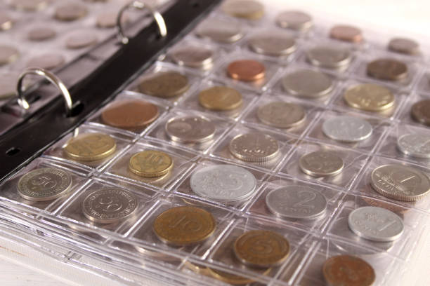istock Many coins of different countries and times. Numismatics 1390975231