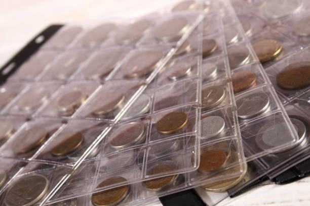 istock Many coins of different countries and times. Numismatics 1390975301