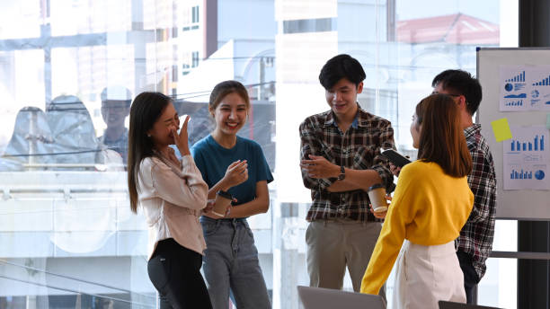 istock Young business team is brainstorming and working on an important project at creative office. 1390975482