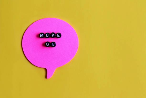 istock Top view image of alphabet cubes with text MOVE ON on speech bubble. 1390976218