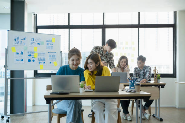 istock Team of creative designer collaborating on their new project at modern office. 1390976354