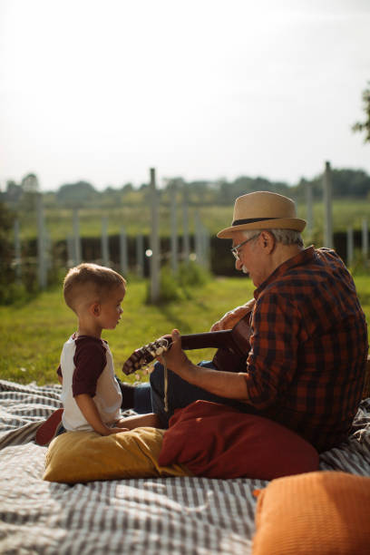 istock Song on guitar for grandson 1390976384