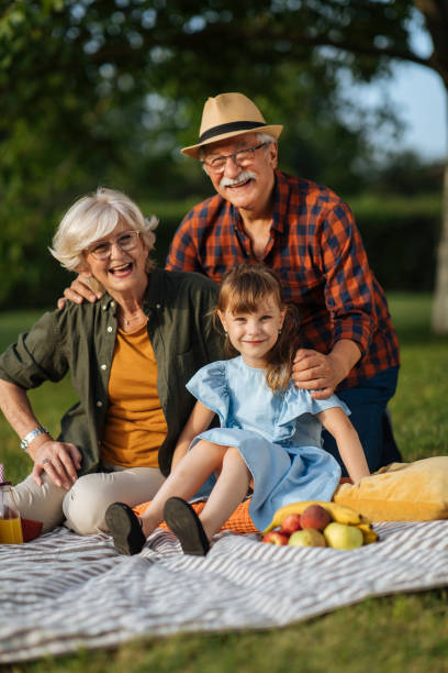 istock Older couple with granddaughter 1390976416