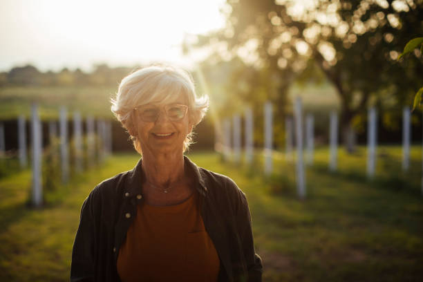 istock Woman standing in vineyard 1390976513