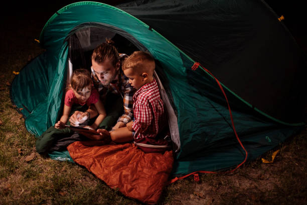 istock Family enjoying camping vacation 1390976604