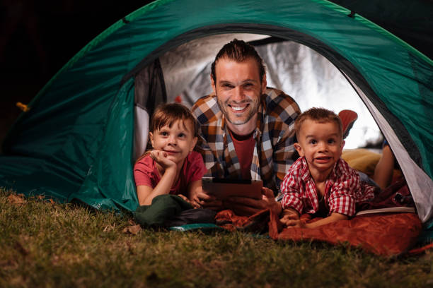 istock Family at camping at night 1390976605