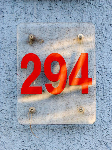 istock Glass home number on a wall 1390977798