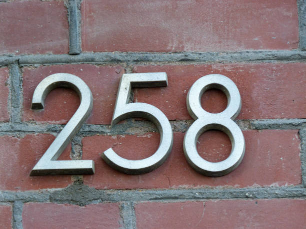 istock Metal home number on a wall 1390977851
