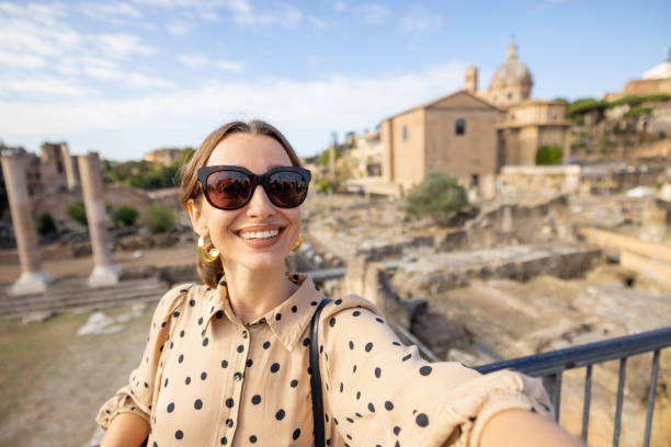 istock Woman visiting Roman forum in Rome 1390979964