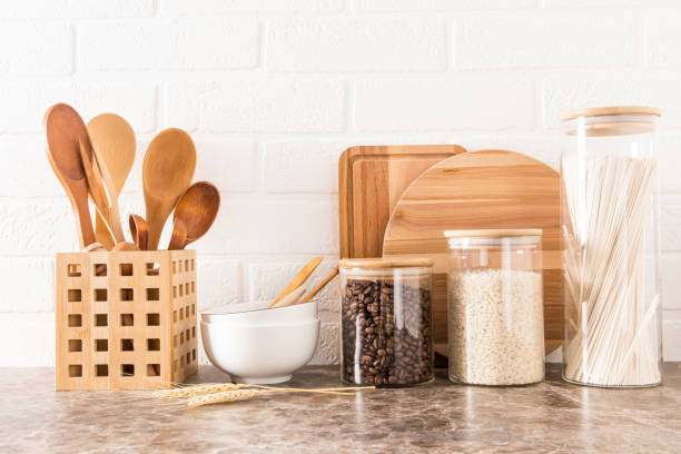 istock a set of kitchen utensils on a dark marble countertop against a white brick wall. interior background of the kitchen. 1390980001