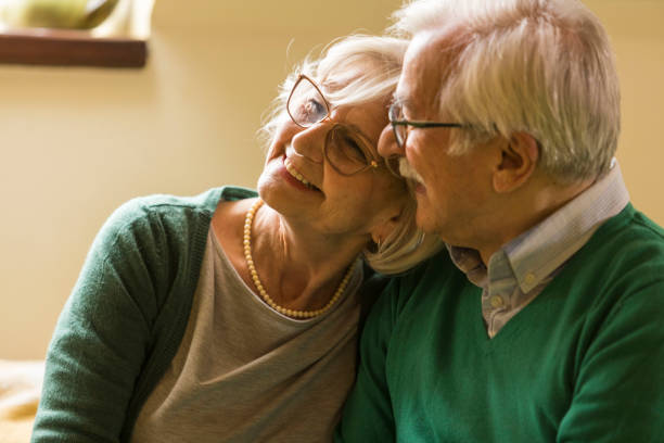 istock Happy senior woman enjoying her husbands' affection 1390980361