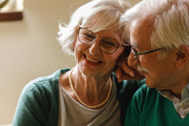 istock Romantic elderly cuddle enjoying a moment of bonding while cuddling 1390980376