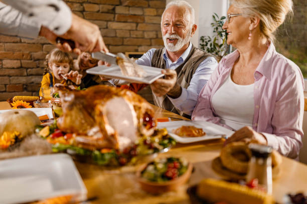 istock Serving Thanksgiving turkey in dining room! 1390981581