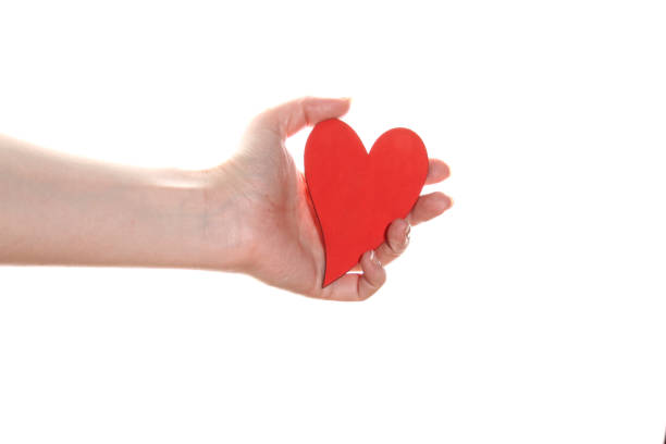 istock Woman hand holds a red heart 1390982250