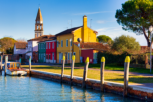 View of the San Michele Arcangelo bell tower and the colorful houses of Mazzorbo, Venice