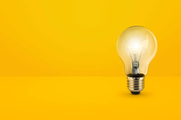 istock light bulbs on bright yellow background in pastel colors simple concept bright idea ideas isolated lamps 1390984155
