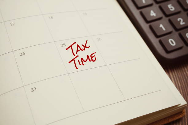 istock Tax Time typography text on schedule planning 1390985269