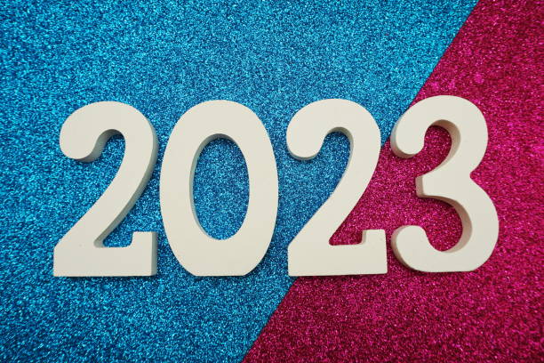 istock 2023 Happy New Year with space copy on blue and pink glitter background 1390985401