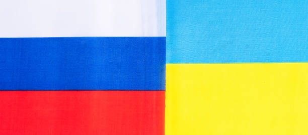 istock Ukraine. and Russia flags. Pray, No war, stop war, conflict and relationship concept 1390985596