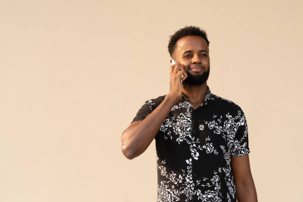 istock Portrait of handsome young African man using mobile phone 1390987099
