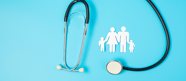 Happy Family day. Stethoscope and paper shape cutout with Father, Mother, and Children. international day of families, Health, wellness, Life and Insurance concepts.