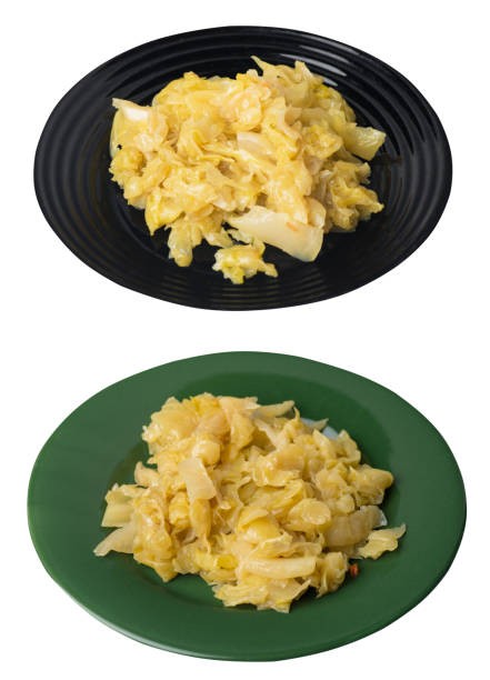 istock braised cabbage in plate isolated on white background.  cabbage top view 1390989248